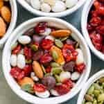 Trail mix and ingredients in white ramekins