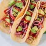 Three cauliflower tacos on a plate