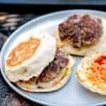 A sausage egg and cheese breakfast sandwich on a plate