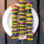 Three colorful vegetable kebabs on a plate